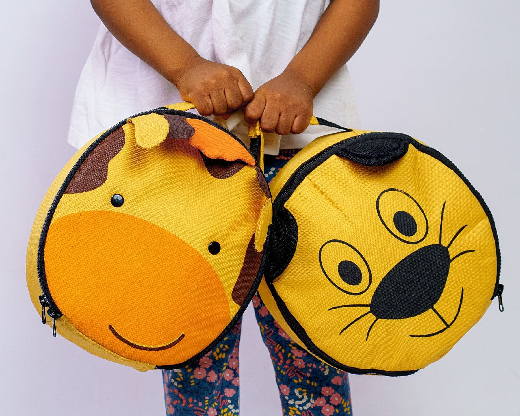 A child holding giraffe and lion Lightbulb lunch bags