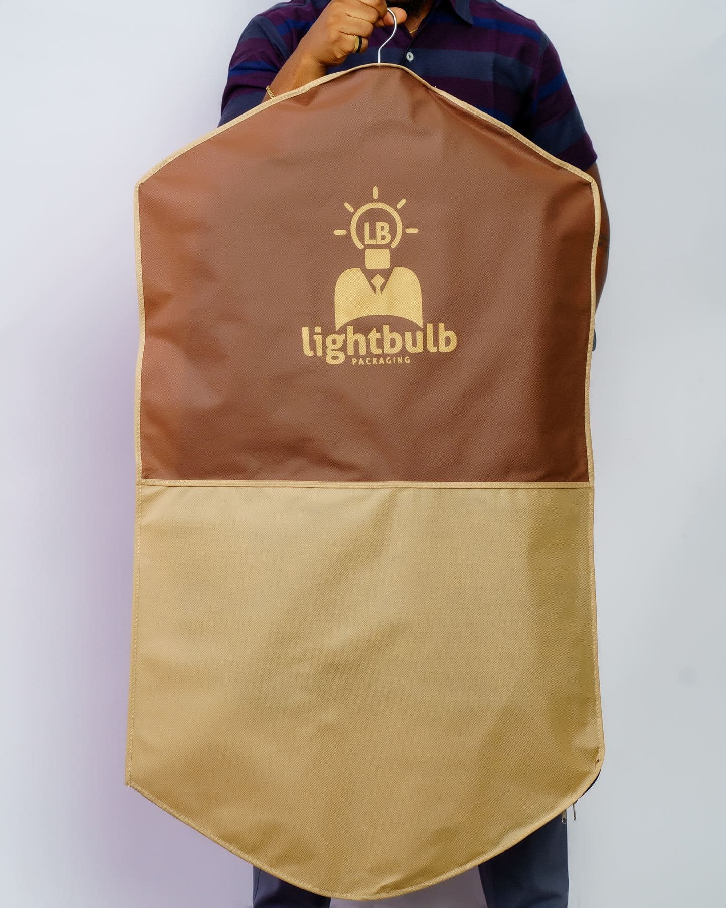 Brown and beige branded garment bag