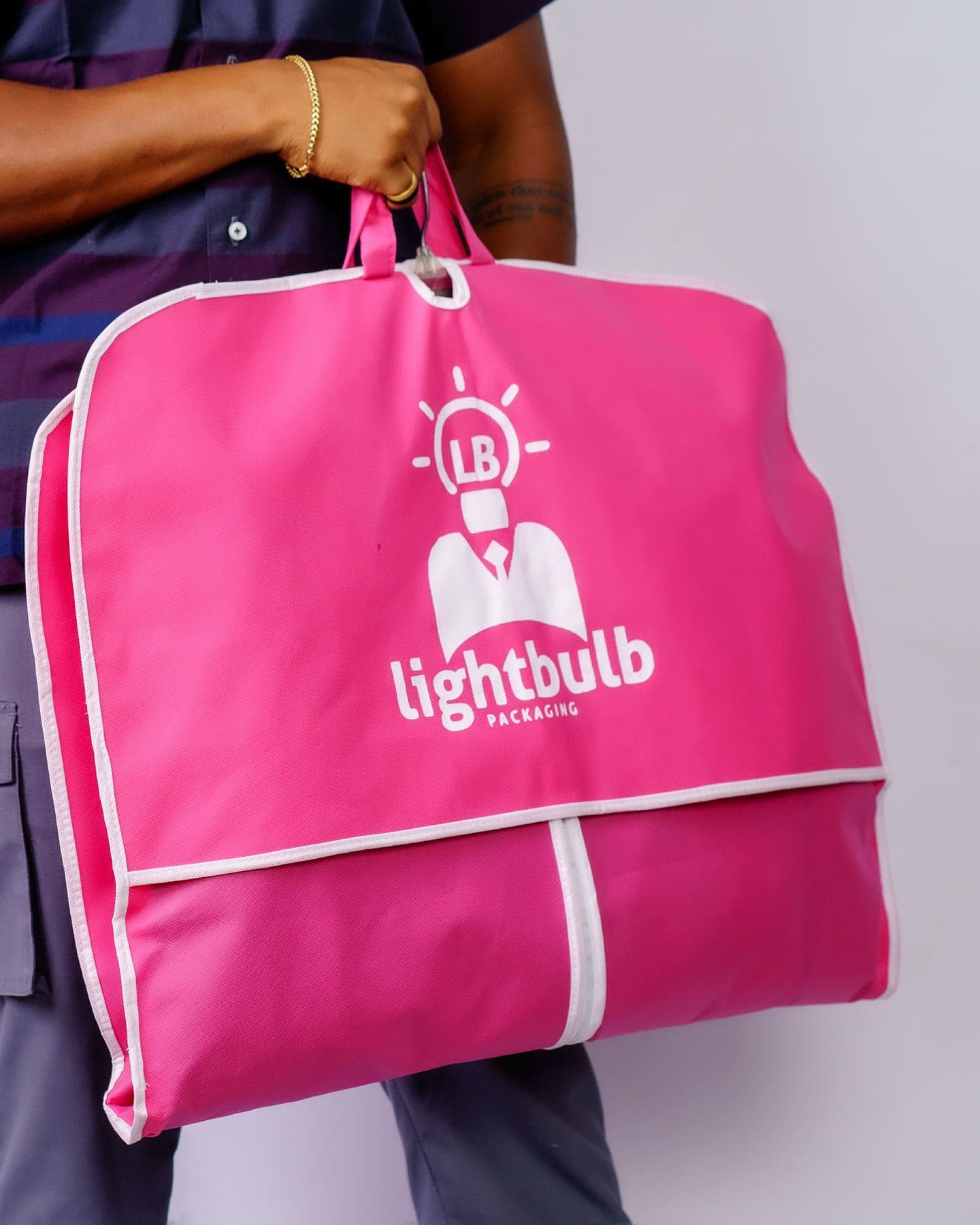 Pink branded garment bag
